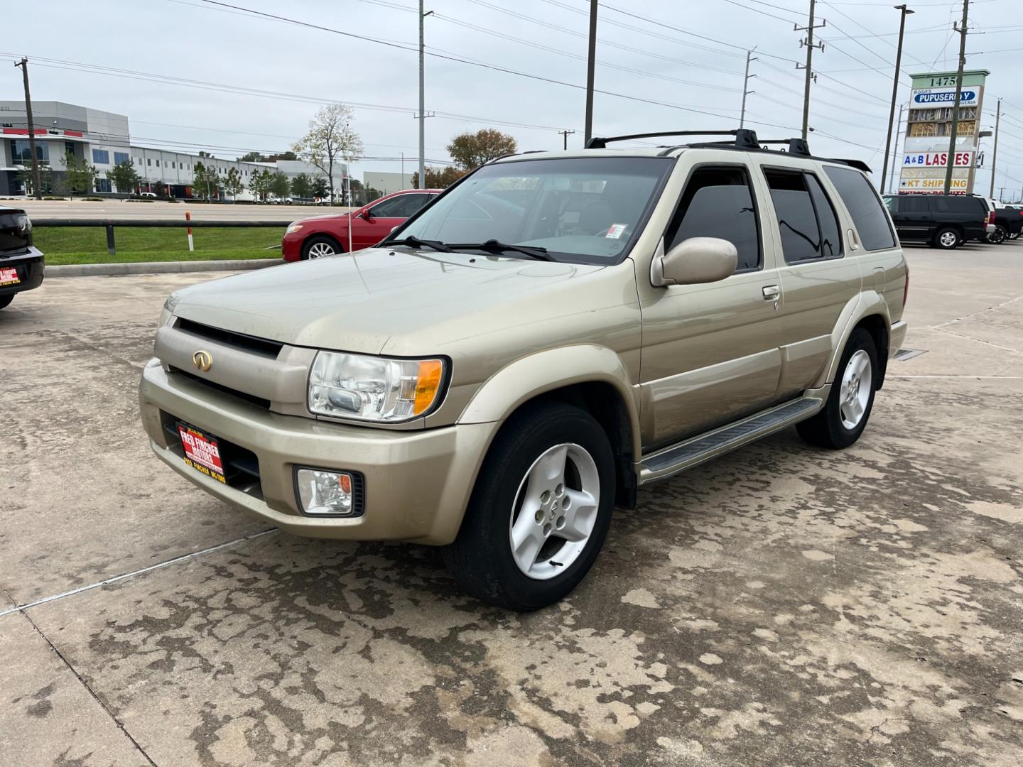 2003 tan /TAN Infiniti QX4 4WD (JNRDR09Y53W) with an 5 engine, 4-Speed Automatic Overdrive transmission, located at 14700 Tomball Parkway 249, Houston, TX, 77086, (281) 444-2200, 29.928619, -95.504074 - Photo#2